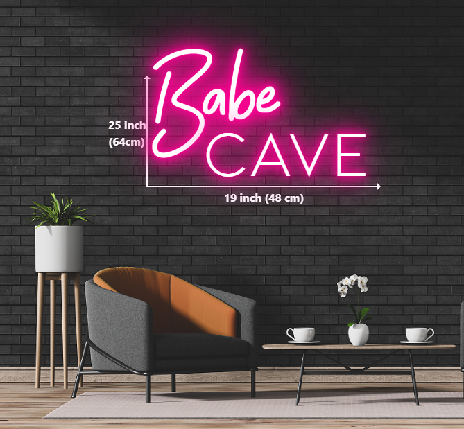 Neon sign reading 'Babe Cave' displayed on a brick wall, creating a vibrant and inviting atmosphere.