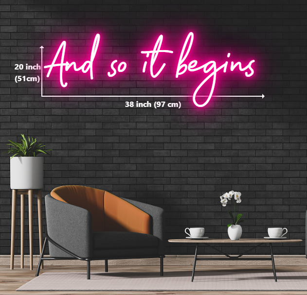custom neon sign with the words 'and so it begins' glowing in vibrant colors, creating an eye-catching display.